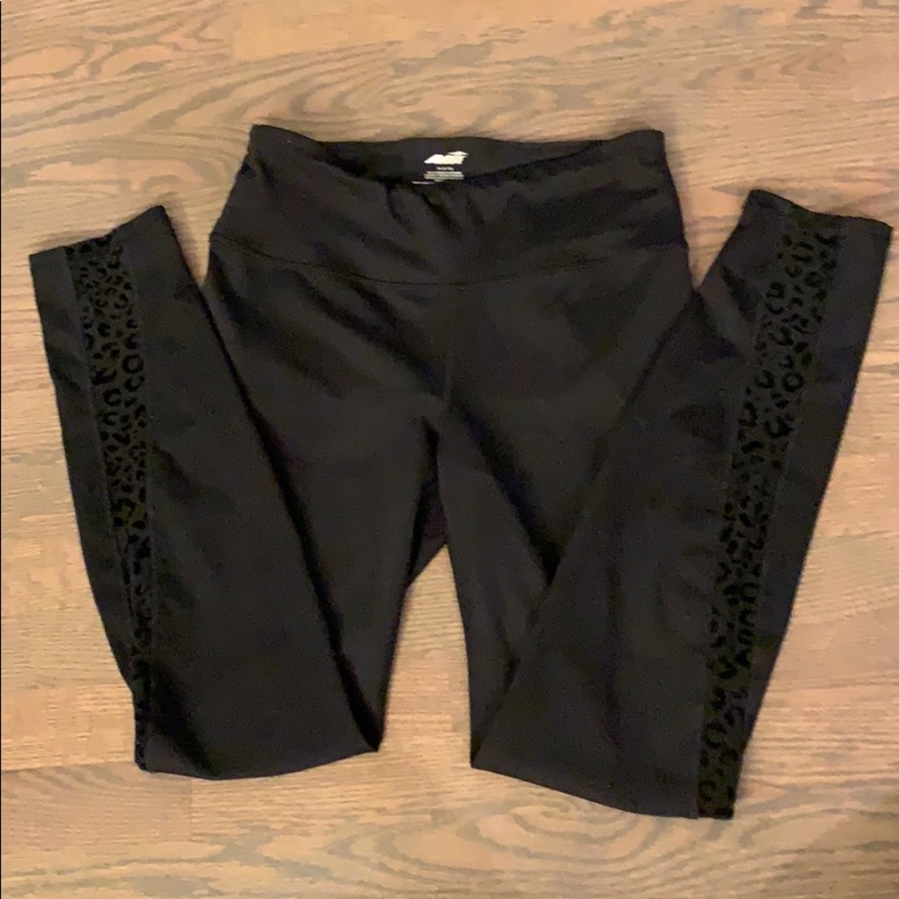 Black, skin-tight, cheetah-print leggings